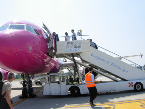 Passengers board a colourful plane at Treviso Airport