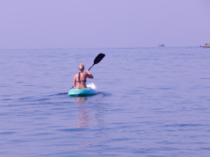 A woman kayaks near Palolem beach in south Goa