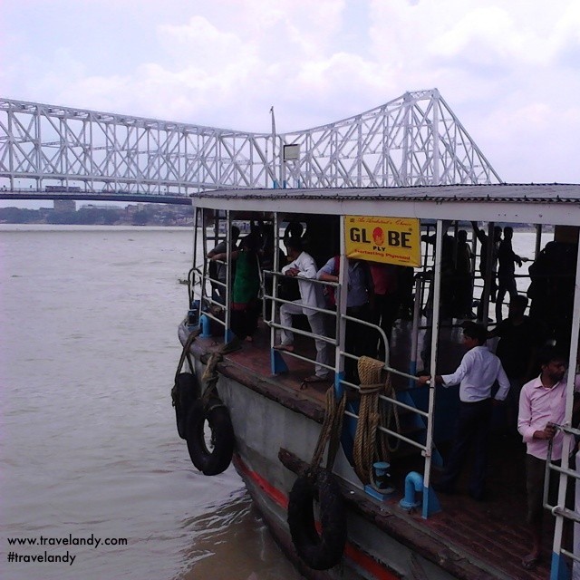 Ferry on the Hooghly river in Kolkata. Tin the background is the Howrah bridge, the busiest cantilever bridge in the world