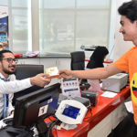 Dubai stamps passports with smiley on Happiness Day